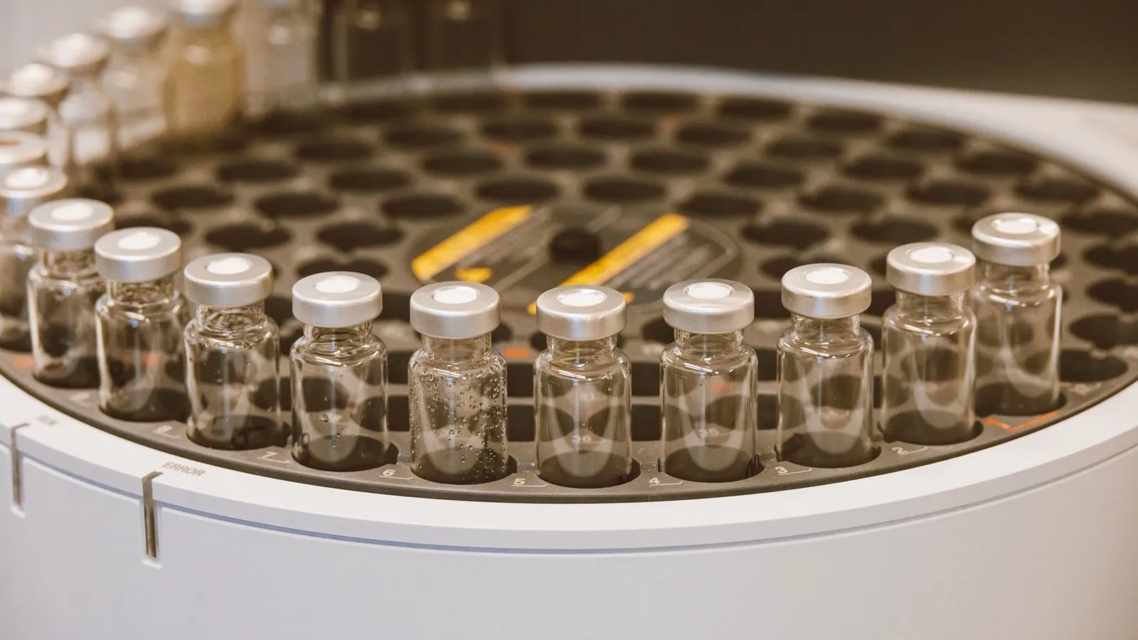 Sealed pharmaceutical vials in an analytical laboratory instrument